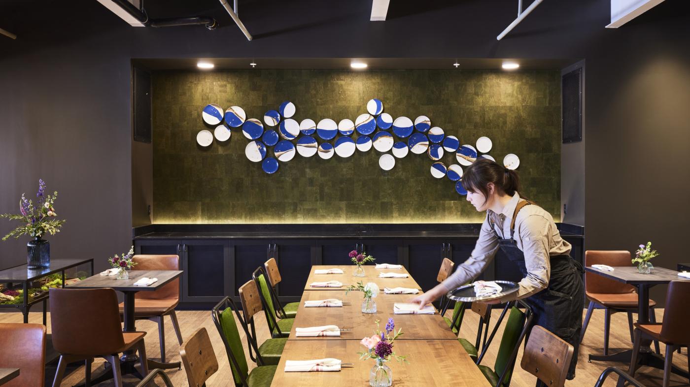 Waitress Setting Table