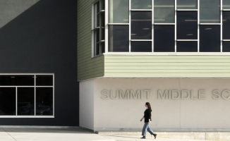 Summit Middle Charter School Exterior with woman walking